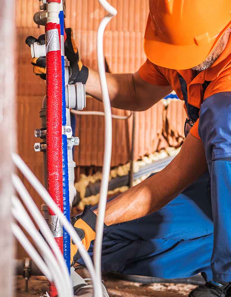Emergency plumbing service in South Jersey with plumber diagnosing pipes