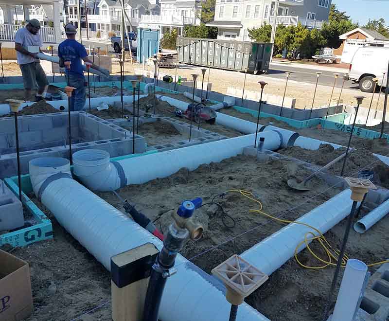 South Jersey plumbing installation by L.F. Fenimore Plumbing and HVAC with underground PVC piping for new construction foundation.